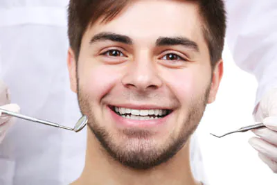 Smiling man during a routine dental check-up